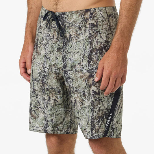 Person wearing camouflage shorts on a white background