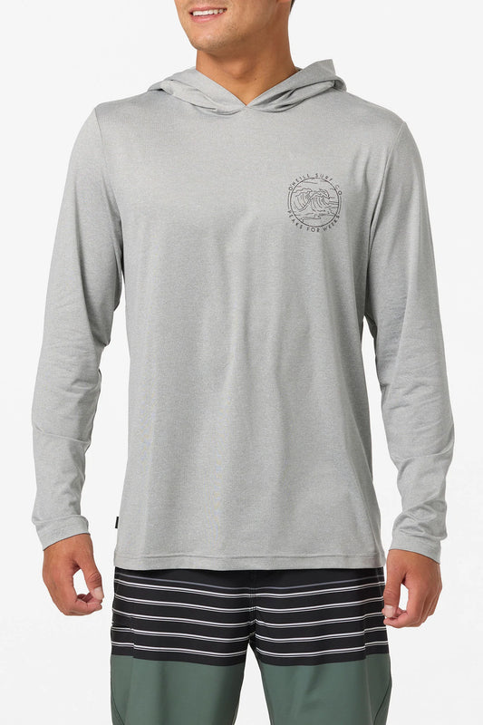 Person wearing a gray hoodie with a logo and striped shorts on a white background