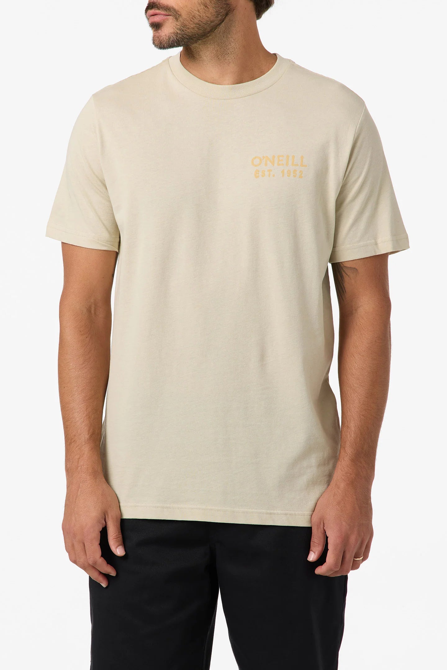 Man wearing a beige t-shirt with text on a white background