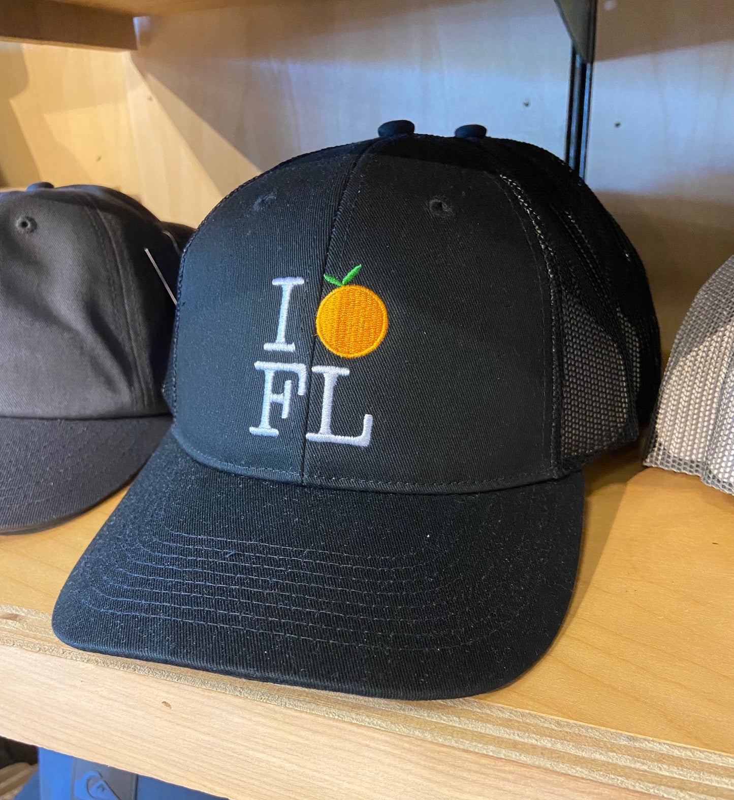 Flomotion I Orange FL Trucker Hat - Black Hats